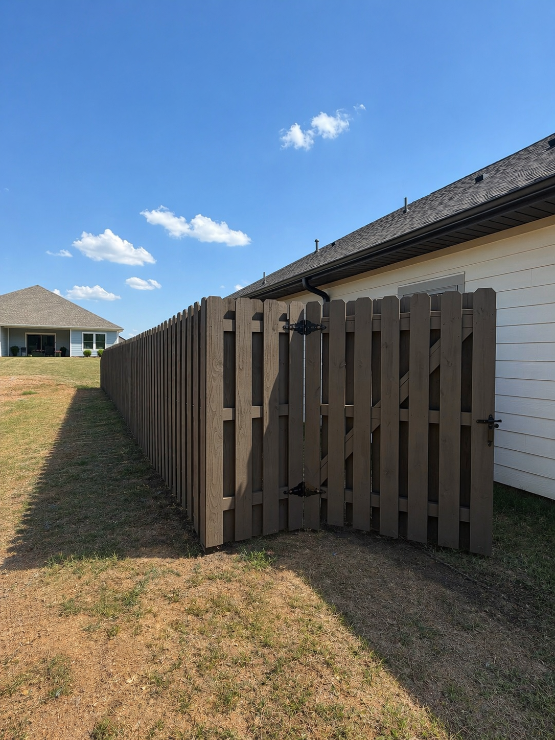 Shadowbox wood fence staining project in Owens Cross Roads Alabama