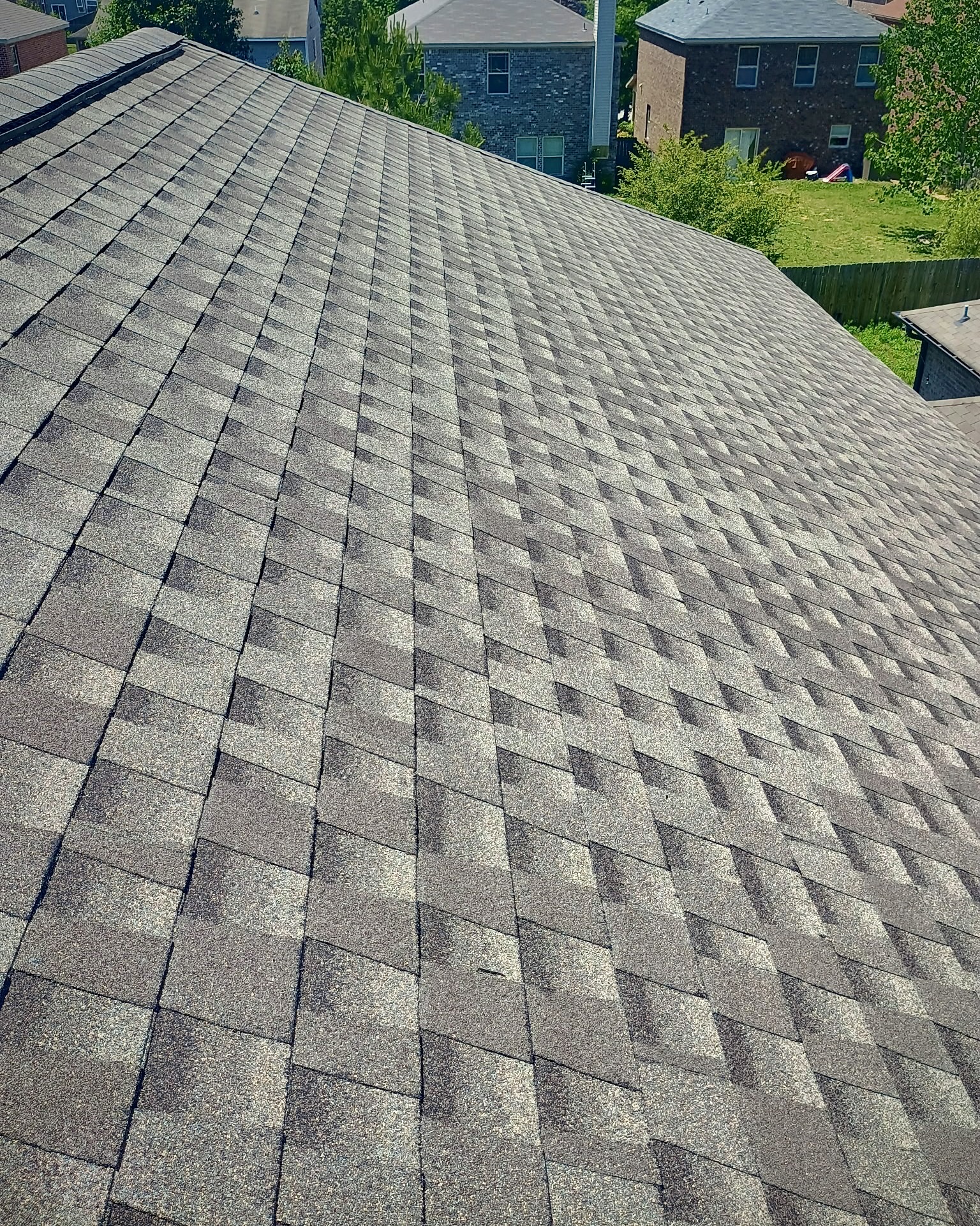Full roof replacement with GAF Timberline architectural shingles ridge vent and underlayment on two story home in Owens Cross Roads Alabama