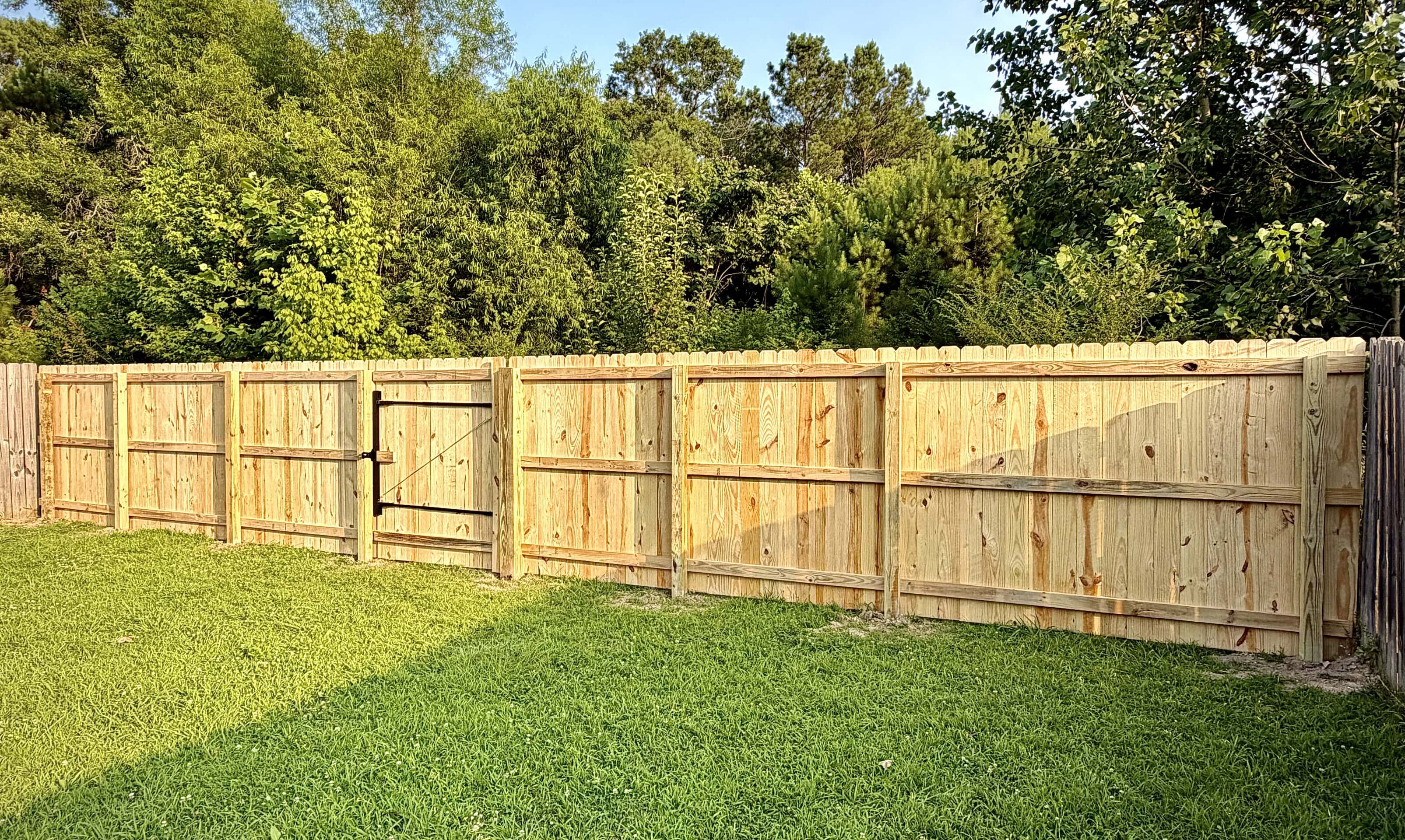 80 foot pressure treated privacy fence with upgraded 6x6 posts and steel framed gates in Owens Cross Roads Alabama