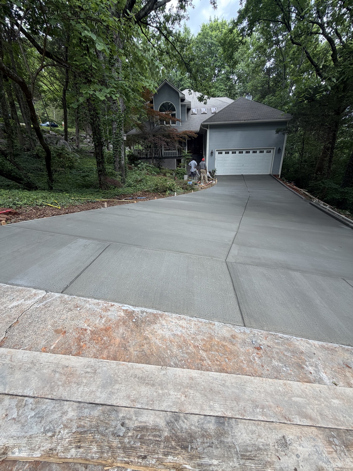 New concrete driveway with professional broom finish in Huntsville Alabama