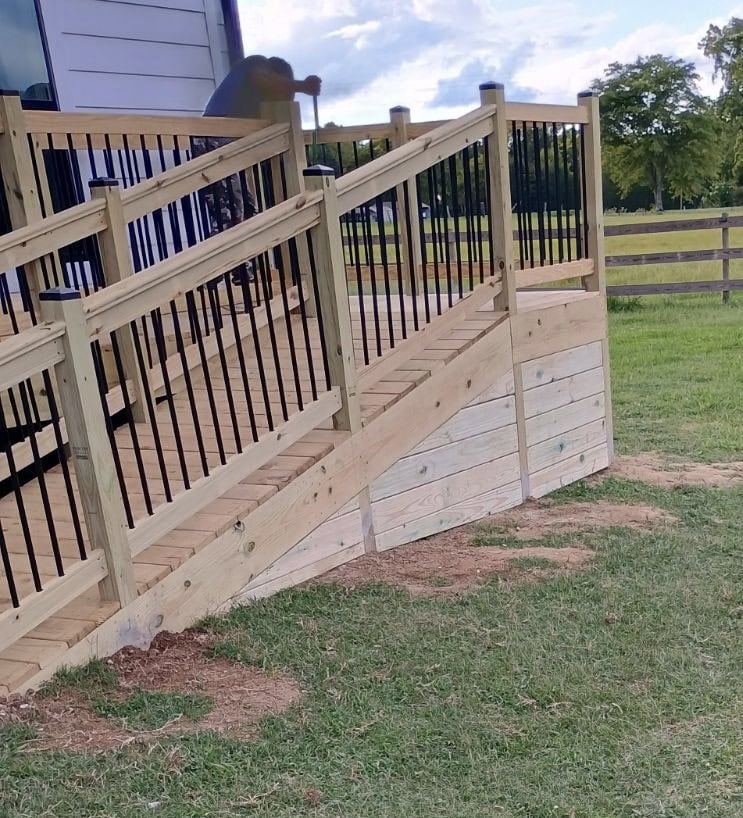 Custom pressure treated deck with black aluminum railing system in Huntsville Alabama