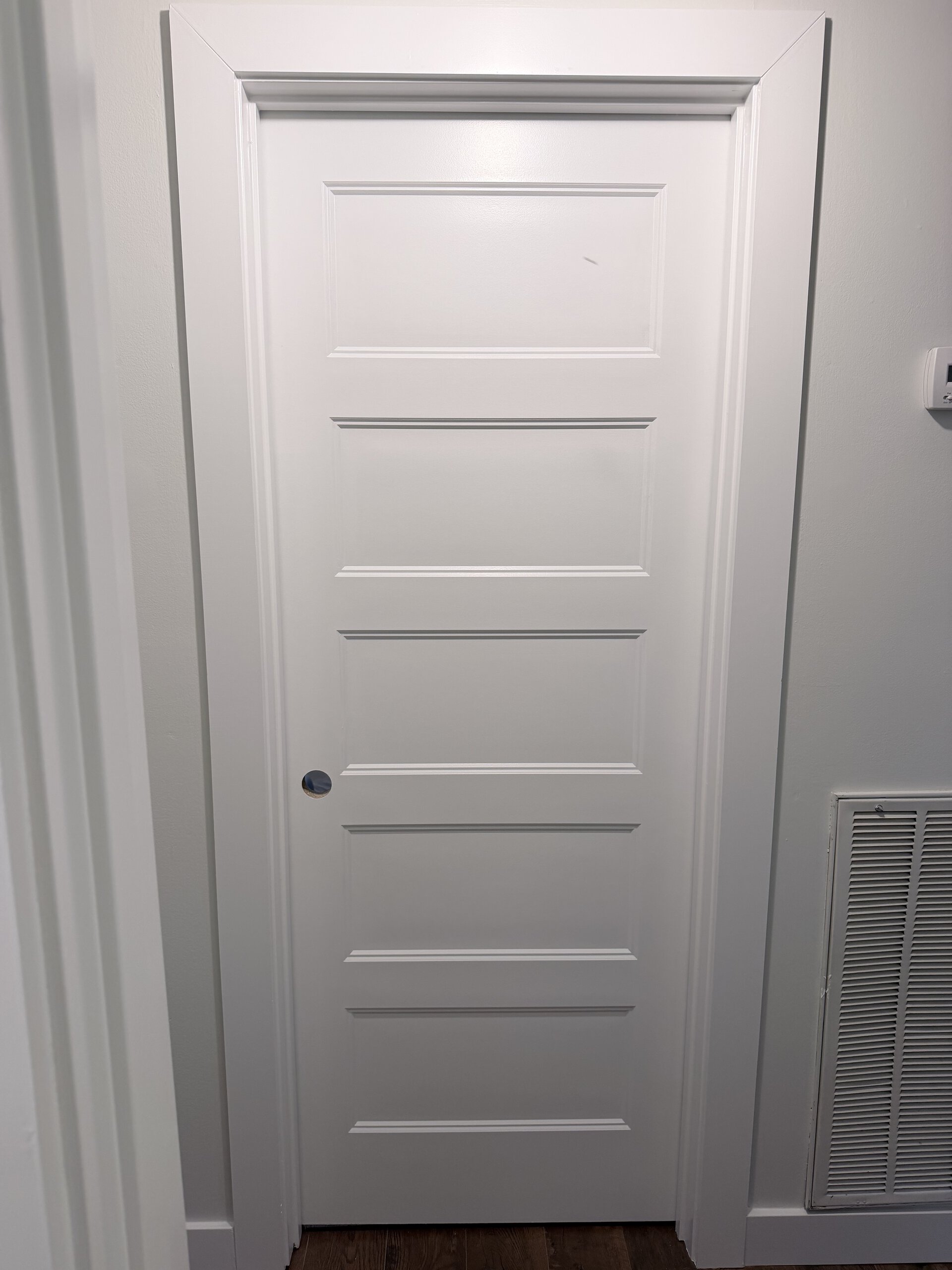 Interior door replacement with new casing baseboards black hardware painting and trim in New Hope Alabama