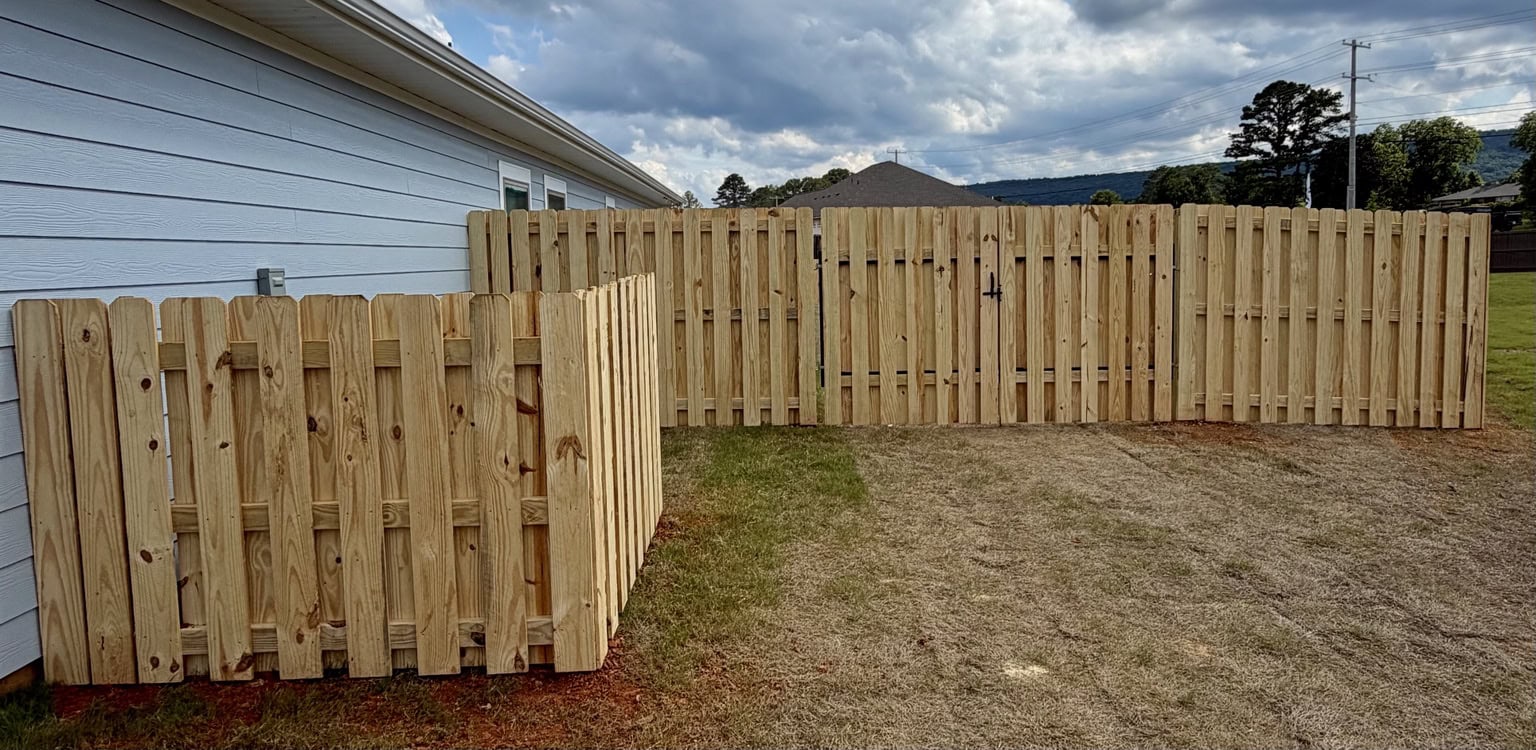 320 foot shadowbox fence with custom AC enclosure and steel framed gates in Owens Cross Roads Alabama